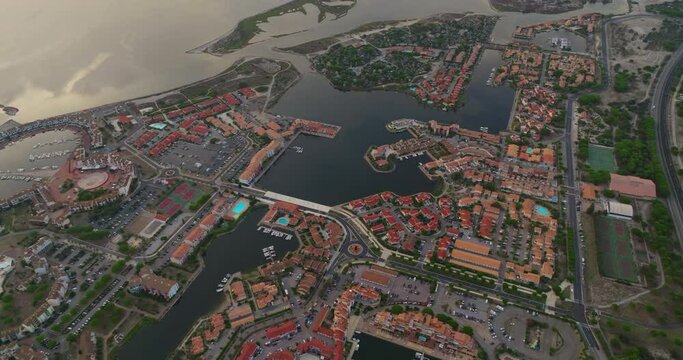 Aerial view of Port Leucate with mediterranean sea in background sunset France, Aude, Occitanie