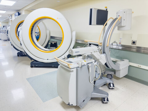Chicago, IL, USA, november 27, 2023, High-tech medical equipment in a modern hospital, X-ray machines and ct scanners and monitors in a well-lit room with medical staff