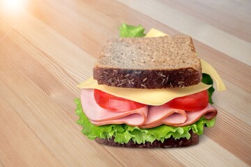 Tasty fresh cheese sandwich on the desk