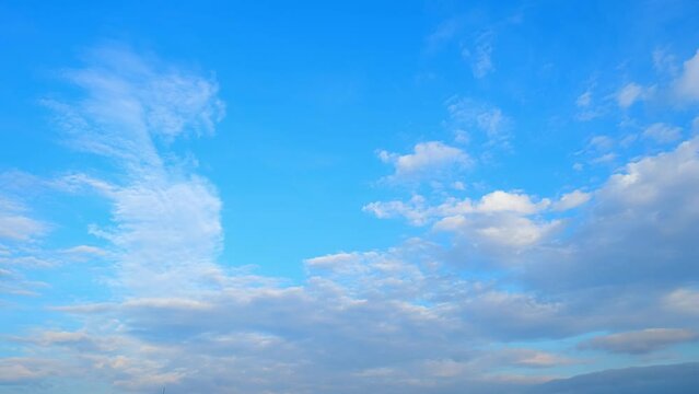 4K : Blue sky time lapse - Watch as the once-clear sky evolves into a mosaic of fluffy clouds in this captivating timelapse. A visual symphony of nature's transitions. Natural beauty background.

