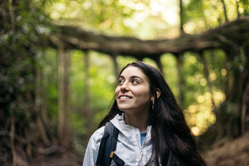 Caucasian brunette woman walking in the jungle in Costa Rica