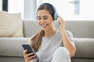 Happy, headphones and phone with woman at home with remote work, music and living room with smile....
