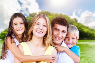 Happy family. young parents and children walk on the beach.