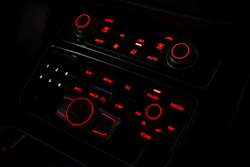 Interior of modern luxury car. Details of automatic transmission gear shift, multimedia control...