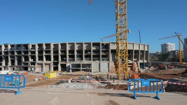Construction cranes working on the new Spotify Camp Nou, Barcelona football club stadium. The new stadium design and renovation is expected to be completed in 2025.