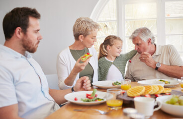 Big family home, children and together at breakfast, eating or talk for help, dad or grandparents at table. Men, women and kid for food, fruit or lunch for memory, conversation or chat in dining room