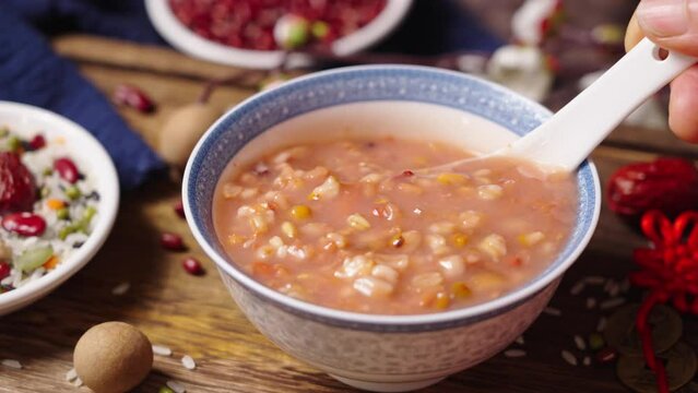 traditional food rice porridge or Laba porridge on wooden table.