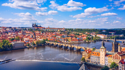Fototapeta na wymiar Prague scenic spring aerial view of the Prague Old Town pier architecture Charles Bridge over Vltava river in Prague, Czechia. Old Town of Prague with the Castle in the background, Czech Republic.