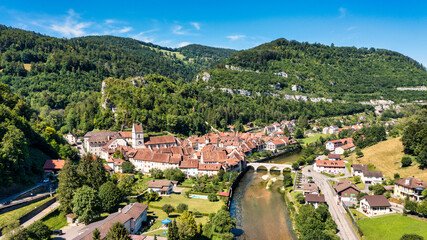 Picturesque Swiss village of Saint-Ursanne on the Doubs River, Switzerland. Village Saint-Ursanne...