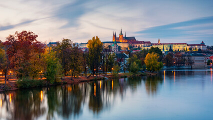 Prague autumn landscape. Prague autumn landscape view to Saint Vitus cathedral. Prague. Prague panorama. Prague, Czech Republic. Scenic autumn aerial view of the Old Town with red foliage. Czechia.