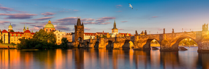 Fototapeta na wymiar Charles Bridge in Prague in Czechia. Prague, Czech Republic. Charles Bridge (Karluv Most) and Old Town Tower. Vltava River and Charles Bridge. Concept of world travel, sightseeing and tourism.