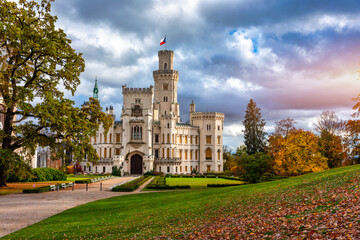 Obraz premium Castle Hluboka nad Vltavou is one of the most beautiful castles in Czech Republic. Castle Hluboka nad Vltavou in autumn with red foliage, Czechia. Colorful autumn view of Hluboka nad Vltavou castle.