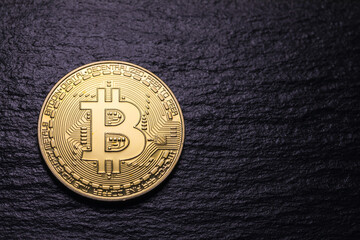 Bitcoin gold coin on dark textured background. Bitcoin & Cryptocurrency. Bitcoin. Crypto currency...