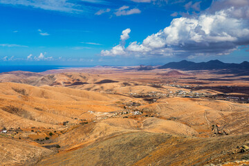 Betancuria National Park on the Fuerteventura Island, Canary Islands, Spain. Spectacular view of the picturesque mountain landscape from the drone of the Betancuria National Park in Fuerteventura - obrazy, fototapety, plakaty