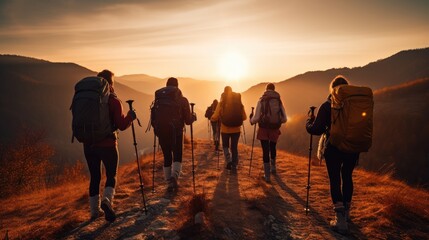 Unrecognizable group of healthy people exercising trekking in national park walking up to mountain with flower glasses field on the walking road, happy tourists lifestyle outdoor, widow sunset light - obrazy, fototapety, plakaty