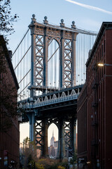 Fototapeta premium Pillar of Manhattan Bridge as seen from an alley in Dumbo district in Brooklyn