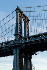 Fototapeta premium Pillar of Manhattan Bridge in Dumbo district in Brooklyn. Popular motif on a trip to New York.