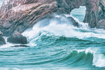 Wave splashing close-up. Crystal clear sea water, in the ocean in San Francisco Bay, blue water, pastel colors.
