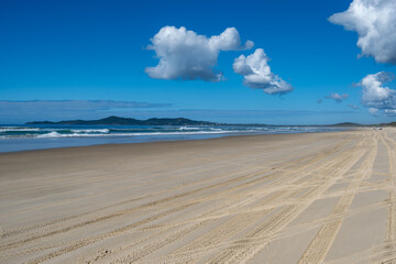Teewah Beach, Queensland, Australia. On the beach looking back towards Noosa. Sandy beach to the horizon.