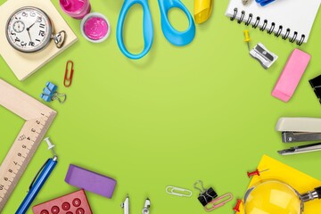 Back to school. Frame of school supplies on background.
