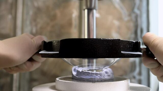 Mouth guard for teeth, printed on a 3D printer in dental clinic laboratory. 4k cinematic slow motion video