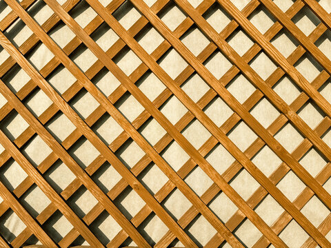 Wooden lattice on the wall as an abstract background. Texture