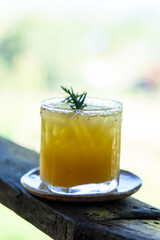 fresh orange juice with herb at afternoon time