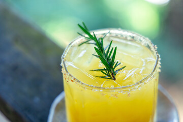 fresh orange juice with herb at afternoon time