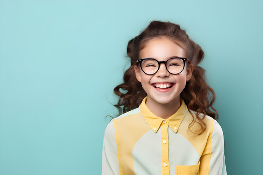 portrait of happy nerdy girl isolated on blue background