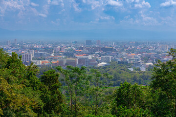 Fototapeta na wymiar Panorama view of Chiangmai Chiang Mai city taken from Doi Suthep Mountains. Lovely views of the Old city at Sunset Sunrise lovely tropical mountains and beautiful nature in the foreground