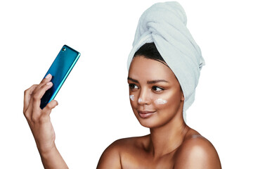 Selfie, beauty and cream with a woman in a towel isolated on a transparent background for hygiene....