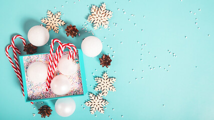 Christmas background. White decorations on a light blue background. Top view with copy space