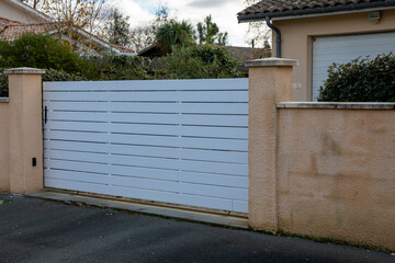 Metal portal white driveway  door entrance gate slide house access garage in suburb