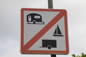 panel road sign indicating the ban on caravans trailers and boat carriers red white prohibition sign
