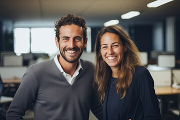 Smiling Business Man and Woman in Office - obrazy, fototapety, plakaty