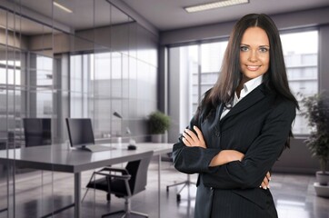 Beautiful business woman smiling at camera in office