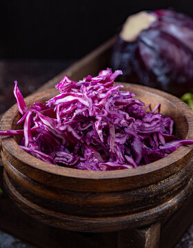 Chopped red cabbage in a wooden bowl