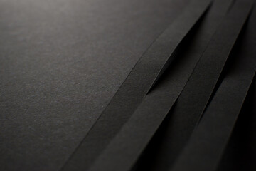 Black background with black 3d stripes, close up - Powered by Adobe
