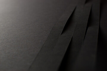 Close up of 3d black stripes on black background, copy space