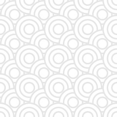 Seamless trendy pattern of circles and arcs, geometric white shapes for textiles and wallpaper. Festive Christmas pattern on a gray background.