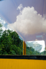 Reflection of the clouds in the yellow train cart