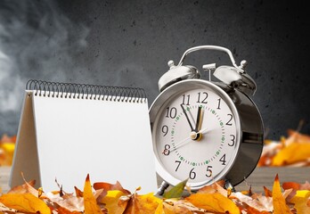 October 2023 calendar and autumn leaf decoration