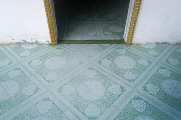 Colorful tiles leading into the door frame  in the Wat Langka temple in Phnom Penh