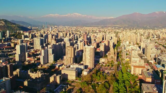 Panoramic aerial view over Almagro Park towards Santiago centro modern urban city skyline and mountains