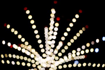 Abstract blur lights night in the city background. Festive background with LED lights garland....