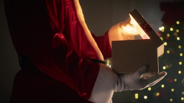 Santa claus opening a magical Christmas box 