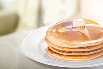 Fototapeta na wymiar A stack of fresh sweet fluffy pancakes