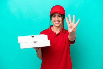 Pizza delivery woman with work uniform picking up pizza boxes isolated on blue background happy and...