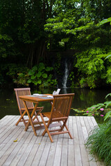 Obraz premium Table and chairs in the tropical surroundings