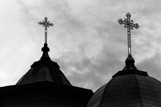 Close-up of crosses on the domes of an orthodox church. Black and white photo